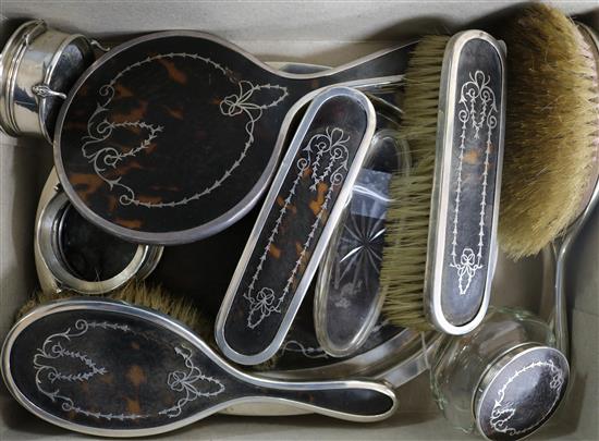 A Mappin & Webb composite ten-piece tortoiseshell and silver pique dressing table set,